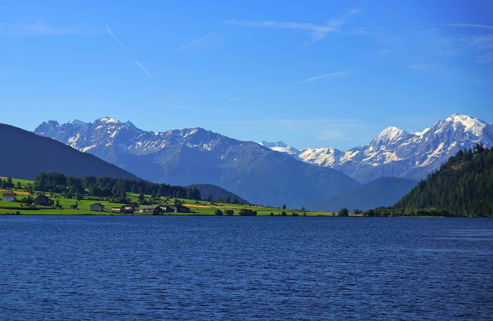 Green meadows surrounding the Haidersee in Obervinschgau